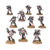 Set of miniature figures with black and pink armor on a white background
