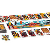 Board game components including cards and a game board on a white background