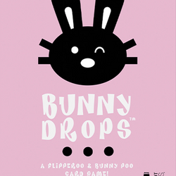 Bunny Drops card game packaging with black bunny face on pink background