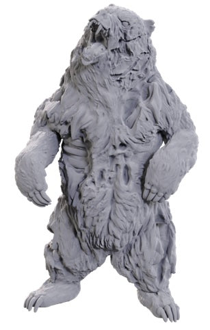 Gray stone sculpture of a creature with bear-like features on a white background
