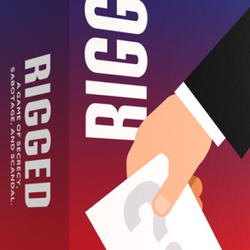 Box of 'Rigged' game with a hand holding a card against a red and blue background