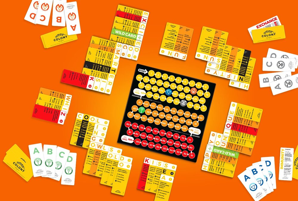 Collection of colorful game cards and a central board on an orange background